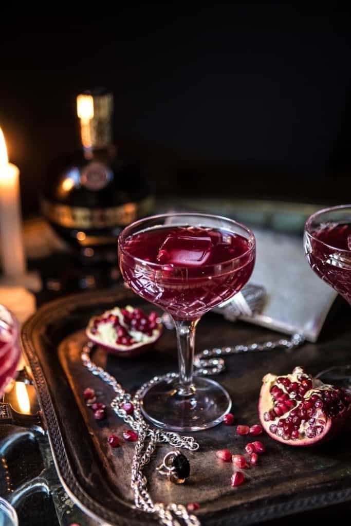 Elegant cocktail with pomegranate in a crystal glass for upscale event nightlife.