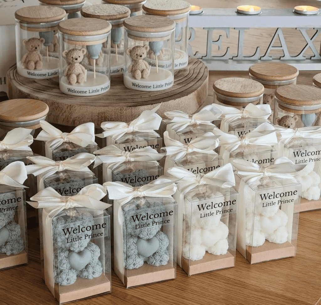 Small teddy bear keepsakes for baby shower favors, personalized with "Welcome Little Prince" text.